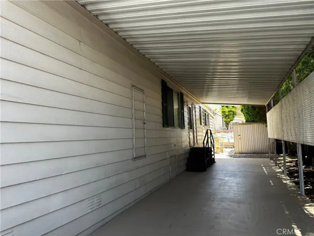 a view of a porch with seating space