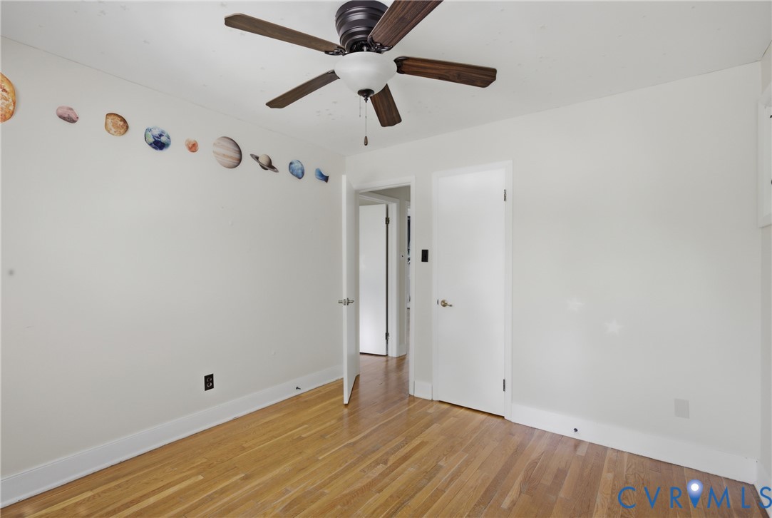 8210 Ireton Road Henrico, VA 23228 - Photo 23 of 36 an empty room with wooden floor and ceiling fan