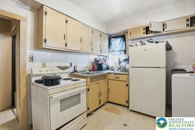a bathroom with a sink a toilet and a shower