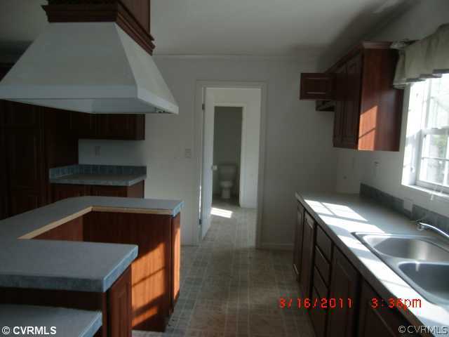 738 Trimers Shop Road West Point, VA 23181 - Photo 4 of 6 a kitchen that has a sink and a stove