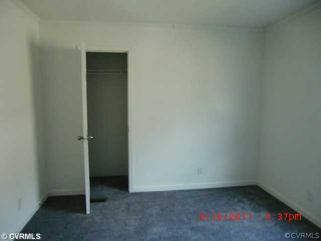 738 Trimers Shop Road West Point, VA 23181 - Photo 5 of 6 an empty room with a bench