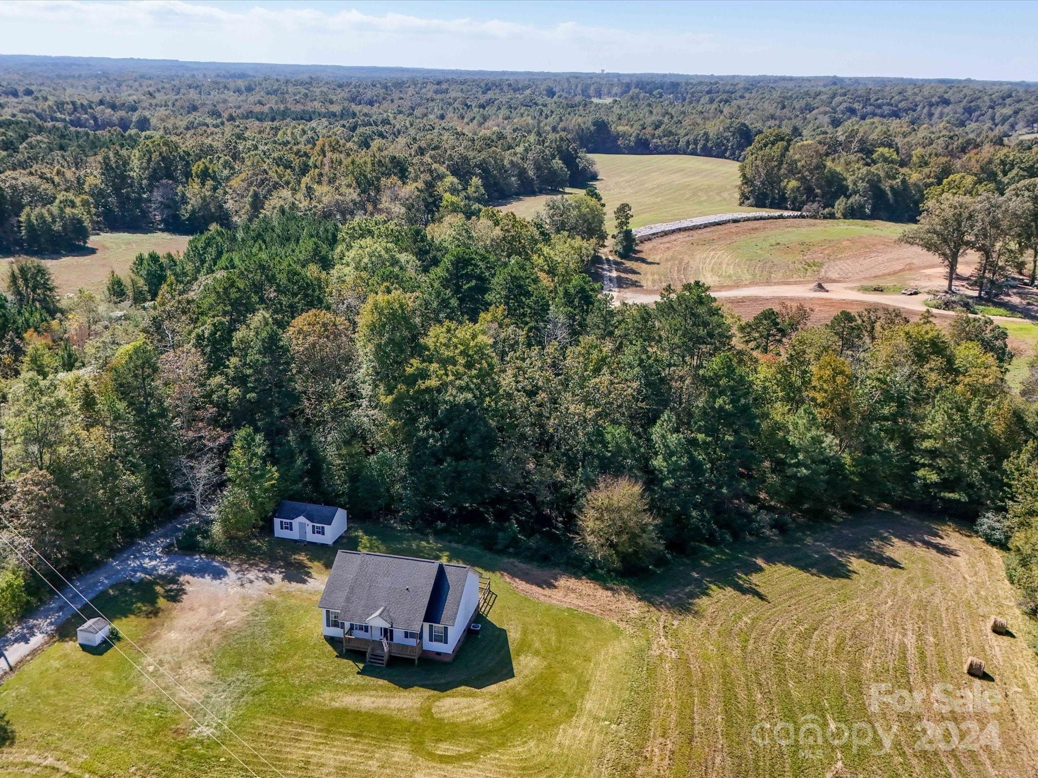 6312 Plyler Mill Road Monroe, NC 28112 - Photo 12 of 41 a view of a lake with a yard