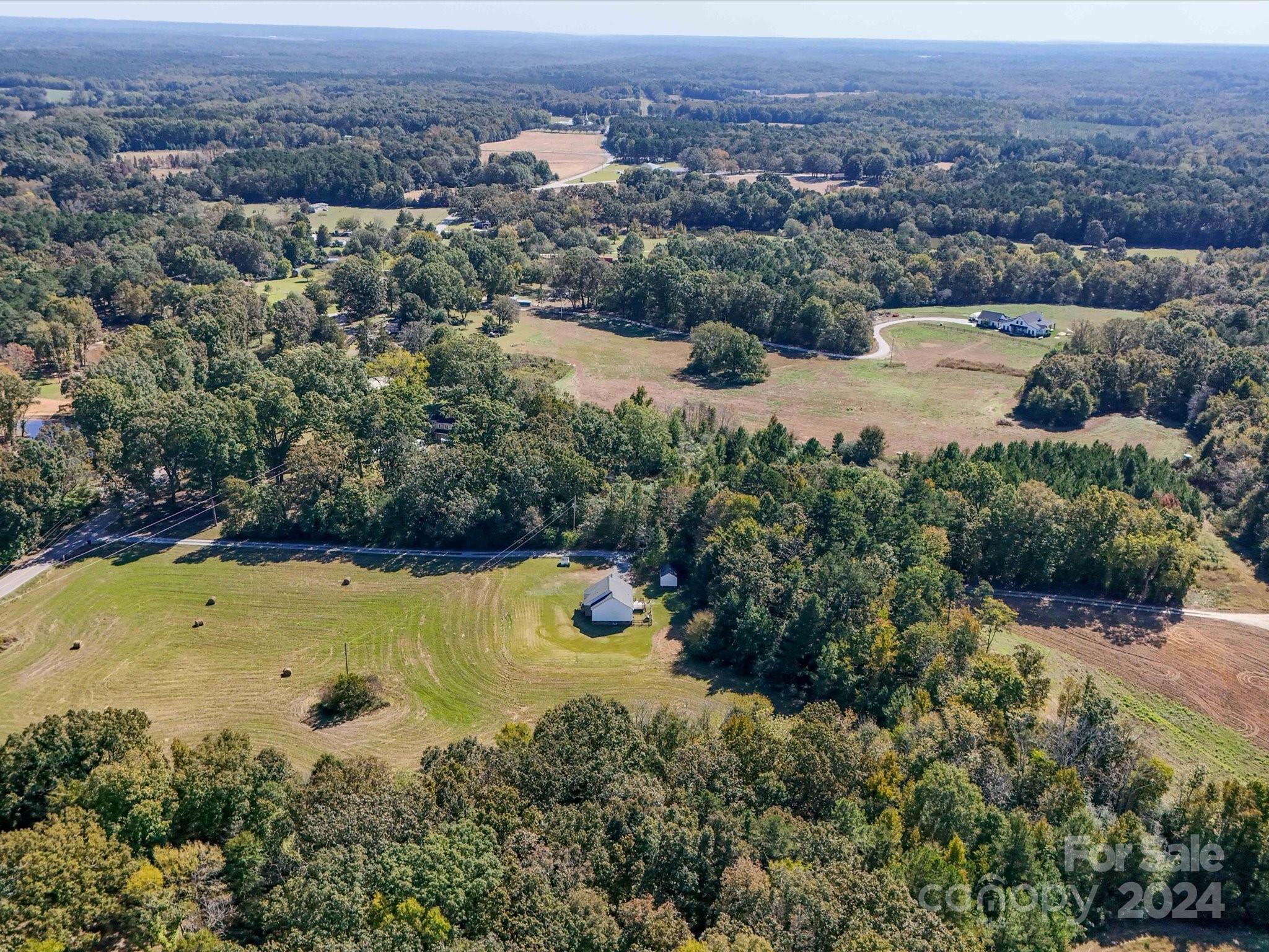 6312 Plyler Mill Road Monroe, NC 28112 - Photo 18 of 41 an aerial view of residential houses with outdoor space and trees
