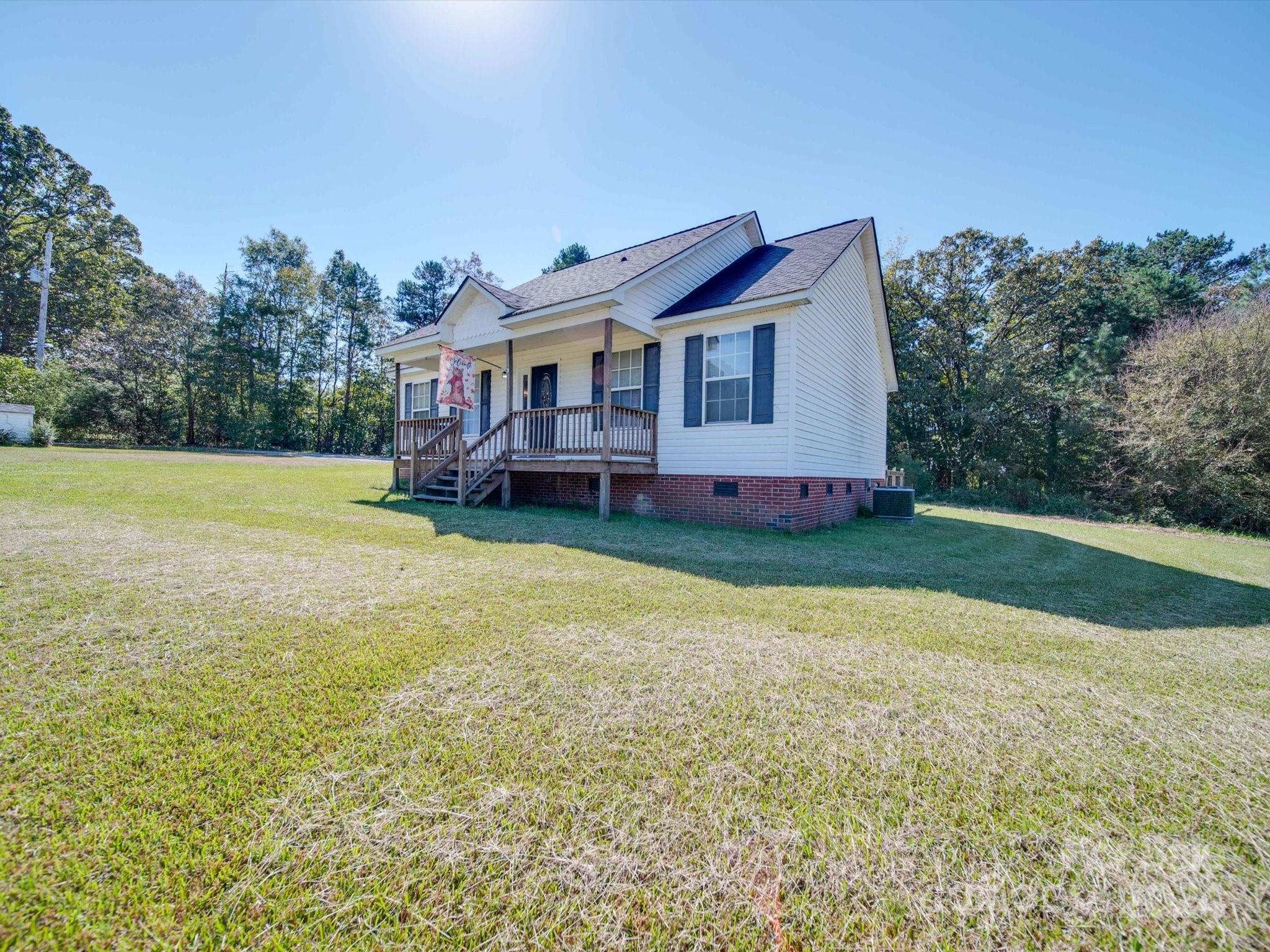 6312 Plyler Mill Road Monroe, NC 28112 - Photo 3 of 41 a view of a house with a yard