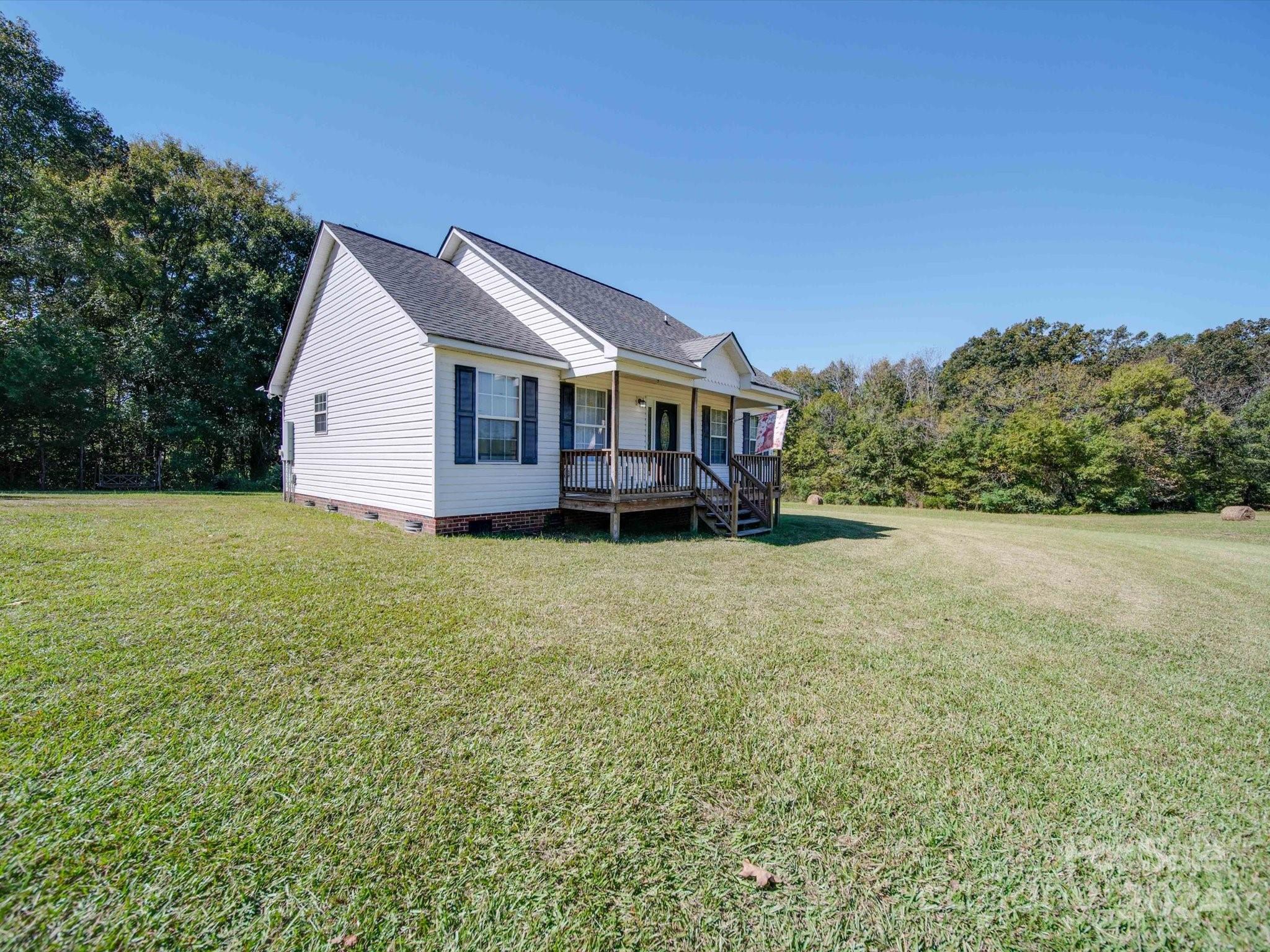 6312 Plyler Mill Road Monroe, NC 28112 - Photo 4 of 41 a view of a house with a yard and sitting area