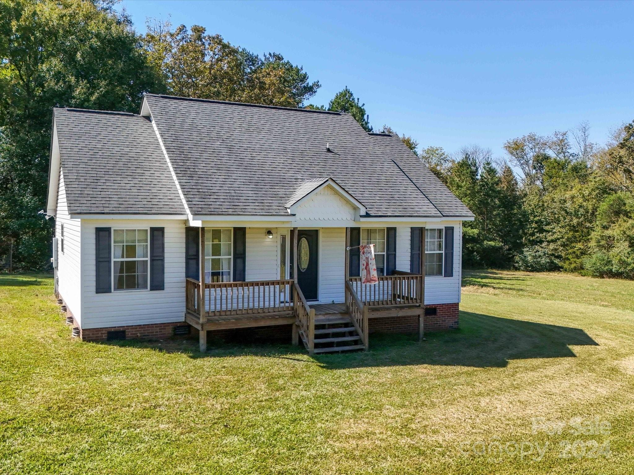 6312 Plyler Mill Road Monroe, NC 28112 - Photo 5 of 41 a front view of a house with a yard
