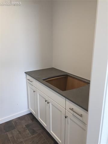 12433 Carmel Ridge Road Colorado Springs, CO 80921 - Photo 13 of 22 Laundry room with designer cabinets and sink