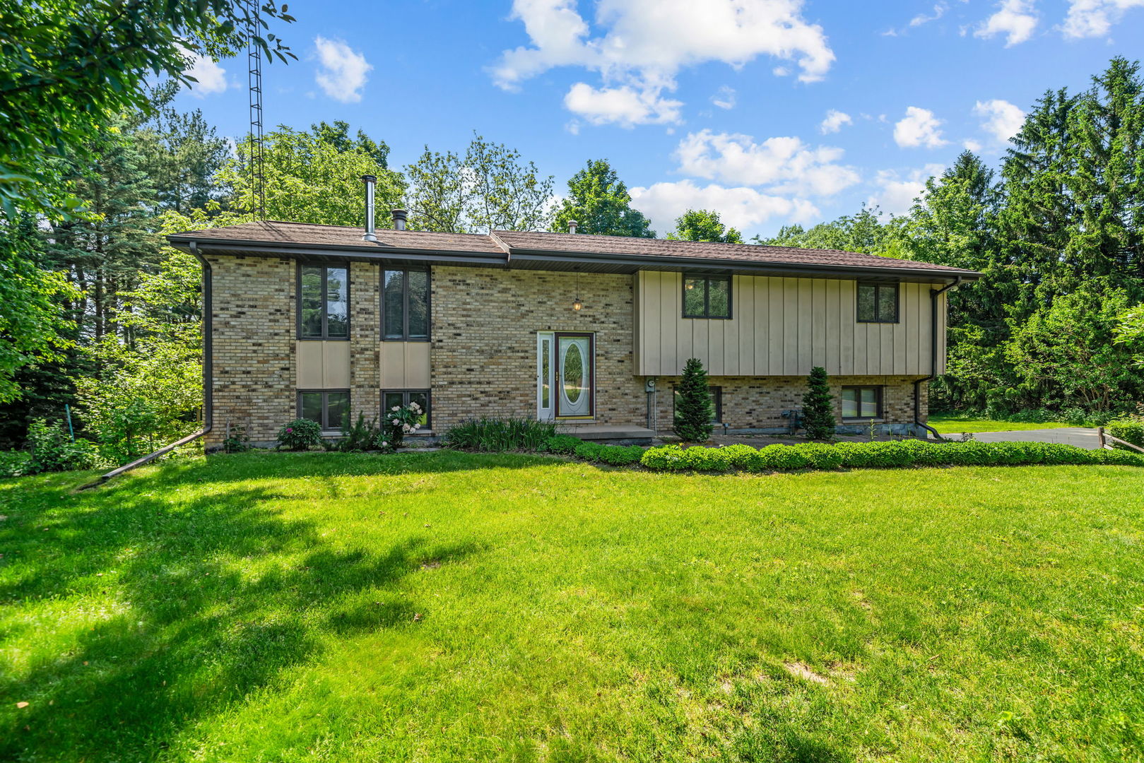 5748 South Skare Road Rochelle, IL 61068 - Photo 1 of 45 a view of a house with a yard