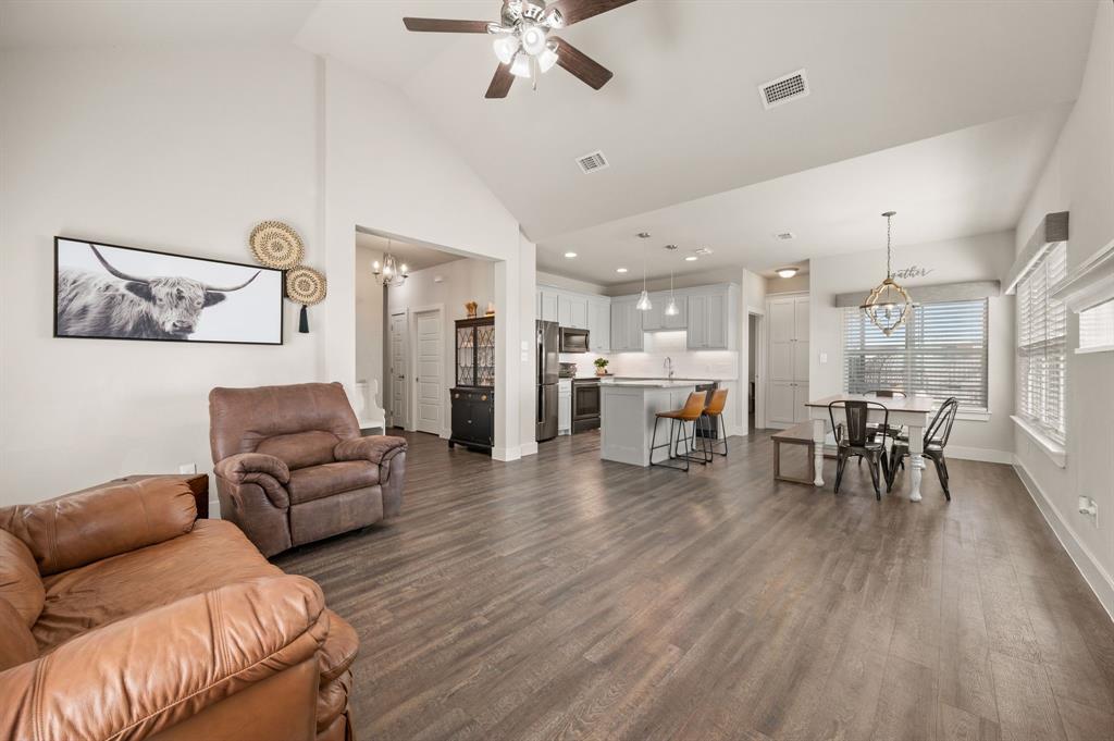 824 East Northside Drive Pilot Point, TX 76258 - Photo 4 of 23 a living room with furniture and kitchen view