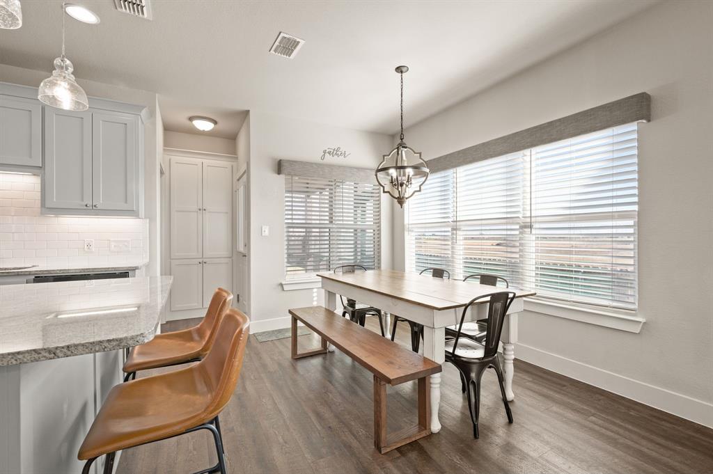 824 East Northside Drive Pilot Point, TX 76258 - Photo 10 of 23 a view of a dining room with furniture window and wooden floor