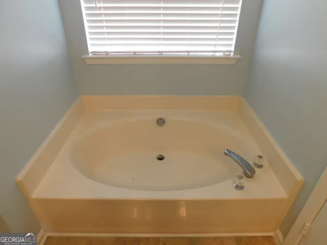 a bathroom with a bathtub