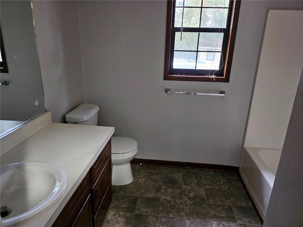 2835 Springdale Road, Unit B Snellville, GA 30039 - Photo 17 of 21 a bathroom with a sink and toilet