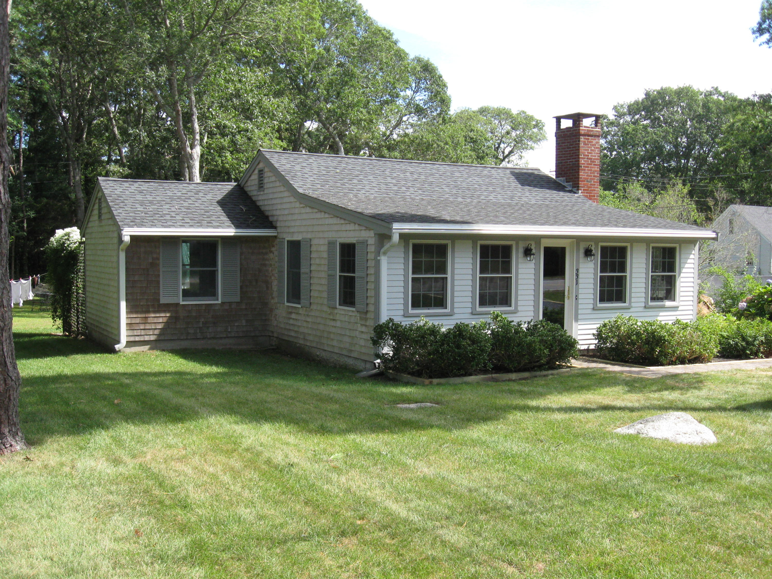 331 Shore Road Monument Beach, MA 02532 - Photo 2 of 11 a view of a house with a yard