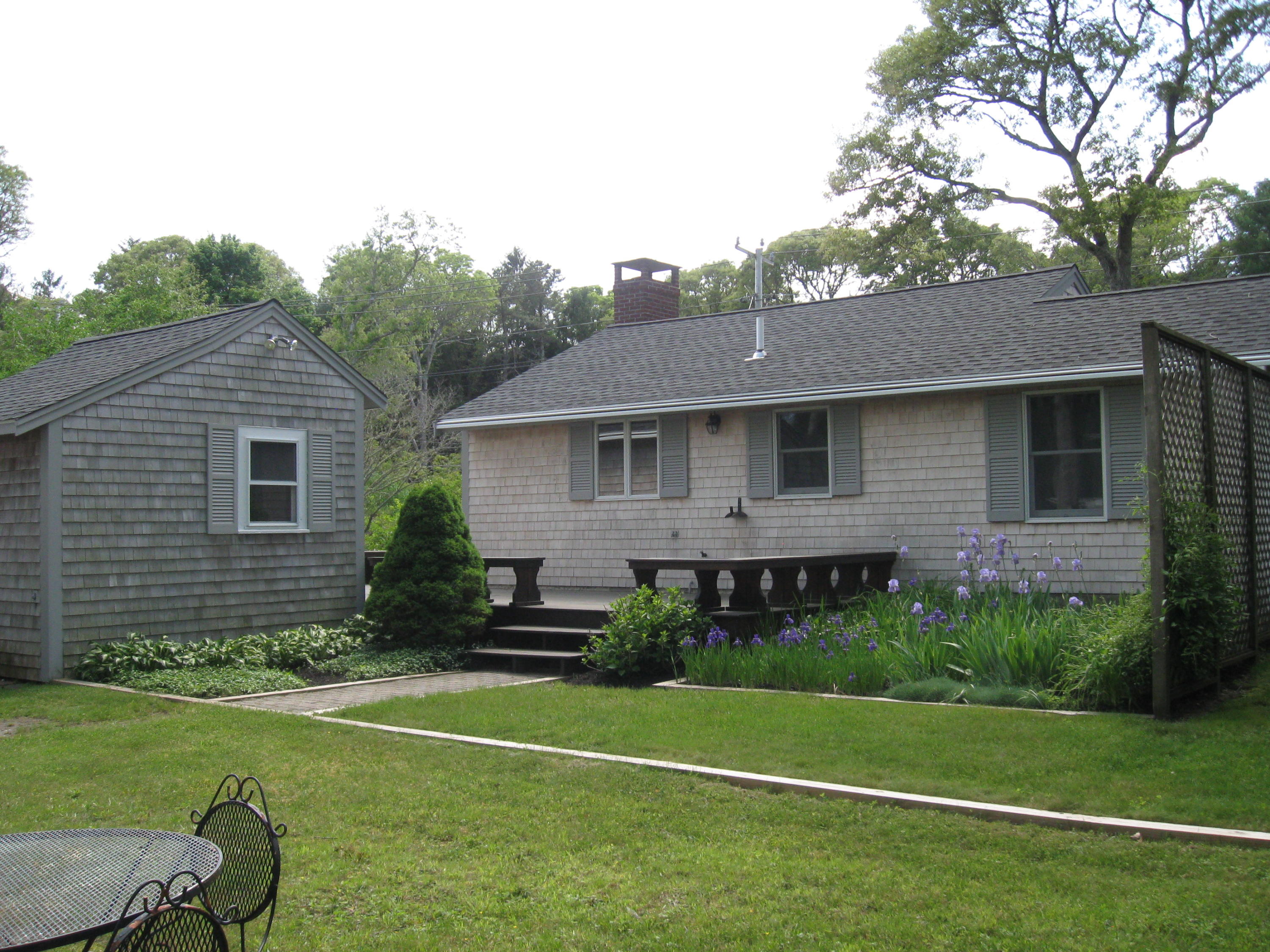331 Shore Road Monument Beach, MA 02532 - Photo 5 of 11 a front view of a house with a yard