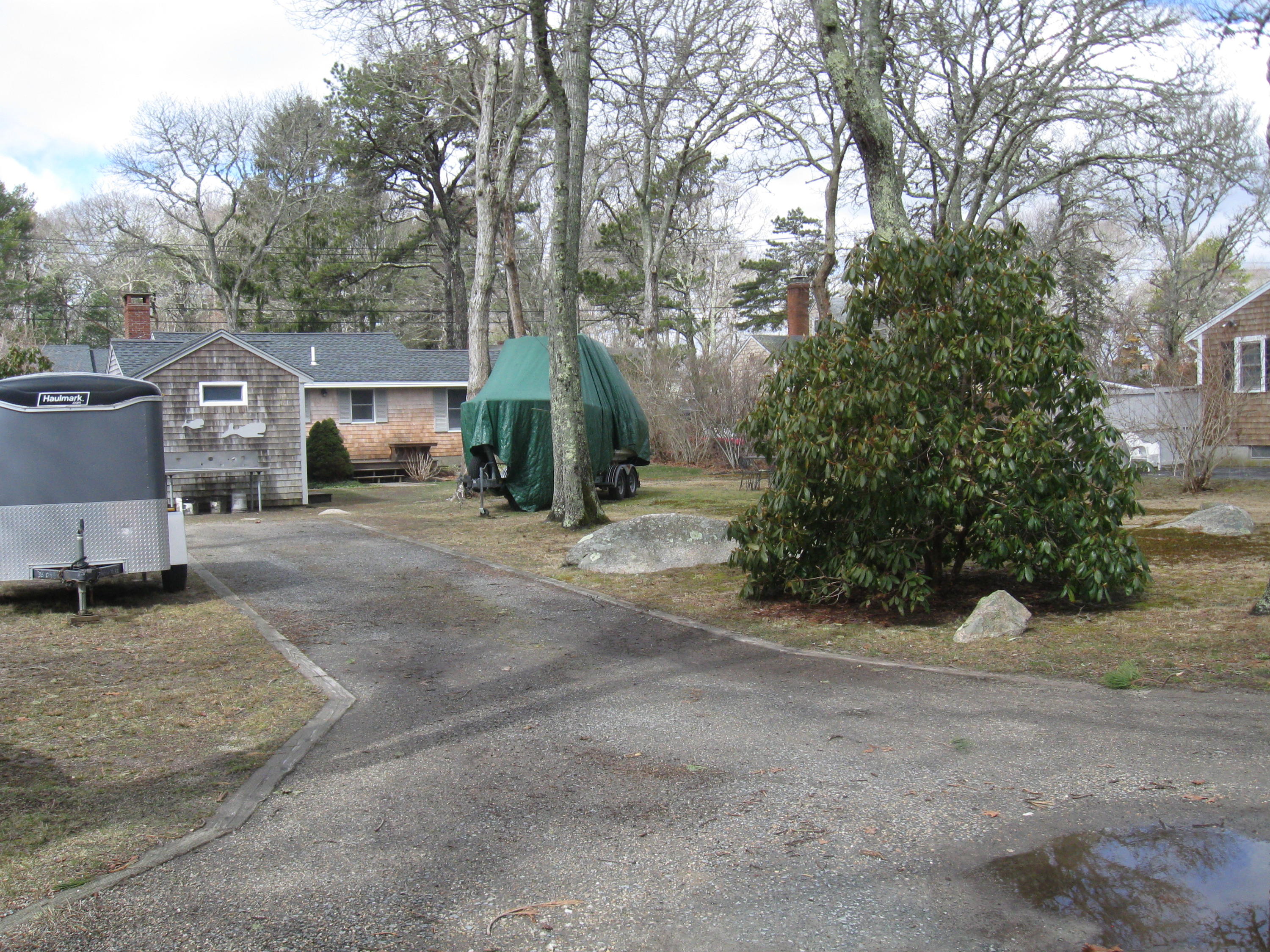 331 Shore Road Monument Beach, MA 02532 - Photo 6 of 11 a view of a house with a yard and garage