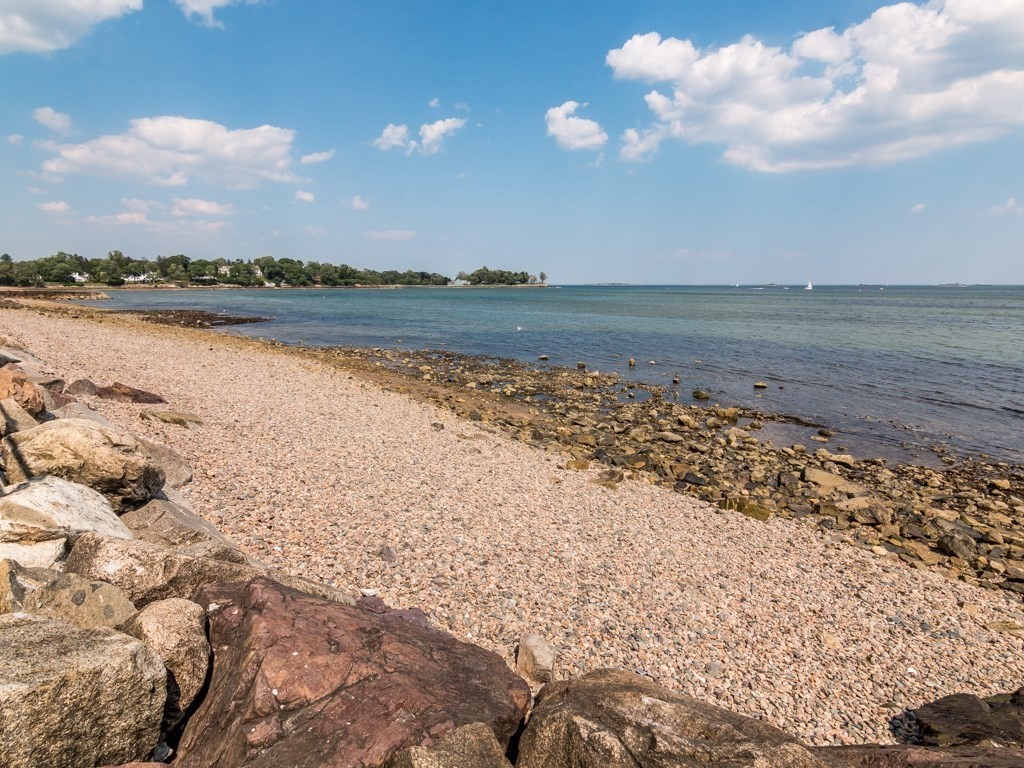 79 Lothrop Street Beverly, MA 01915 - Photo 11 of 12 a view of a lake with a city