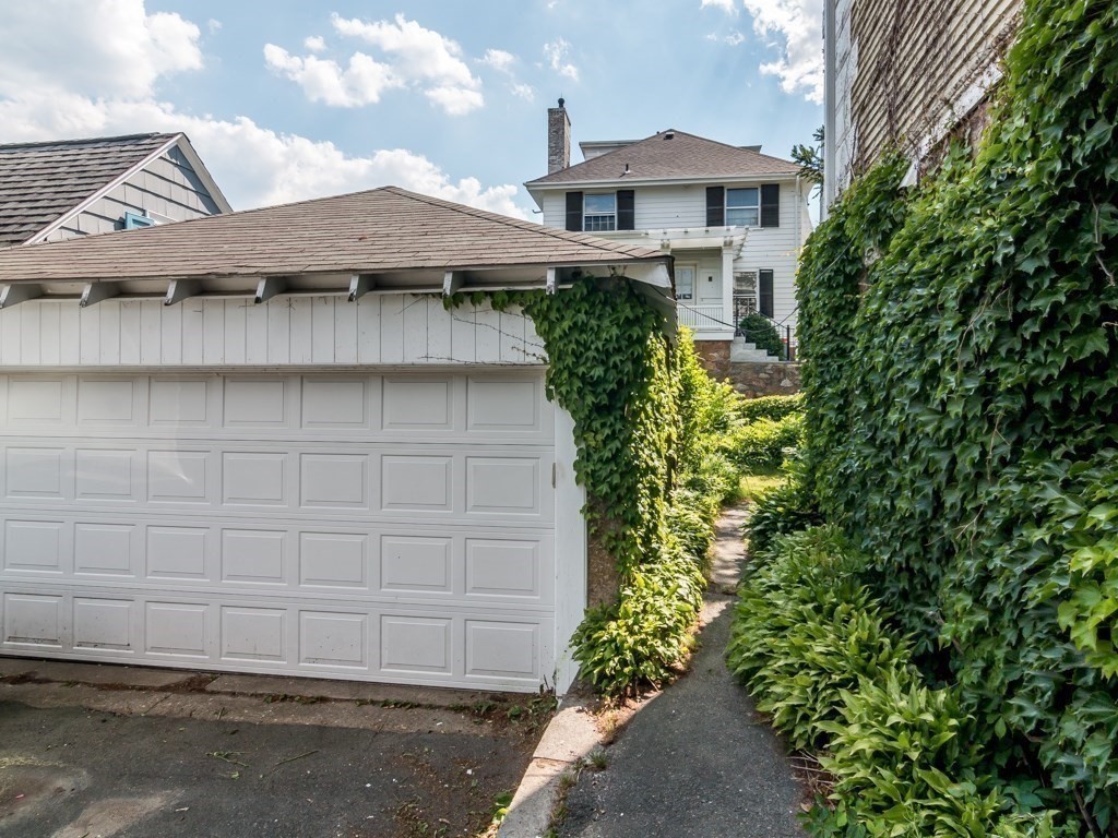 79 Lothrop Street Beverly, MA 01915 - Photo 8 of 12 a view of a house with a yard and plants