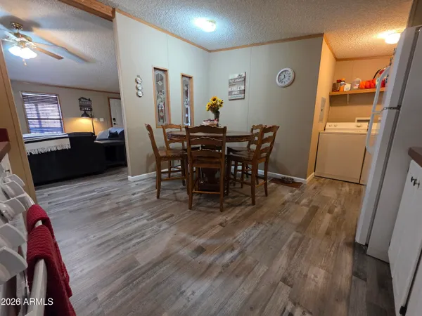 a view of a dining room with furniture and wooden floor