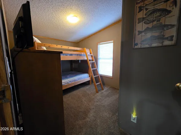 a view of room with furniture and a flat screen tv
