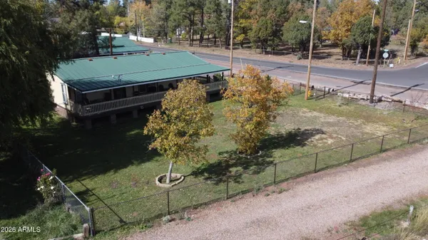 a view of a lake with a mountain and trees in the back
