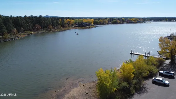 an aerial view of a house with a lake view