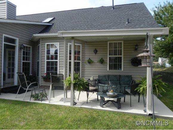 55 Cottage Ridge Road Fletcher, NC 28732 - Photo 16 of 20 a view of house with patio outdoor seating and yard