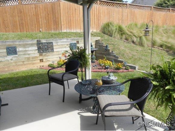 55 Cottage Ridge Road Fletcher, NC 28732 - Photo 18 of 20 a view of backyard with outdoor seating and plants