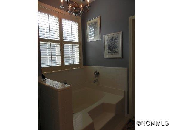 55 Cottage Ridge Road Fletcher, NC 28732 - Photo 9 of 20 a bathroom with a sink and a bathtub