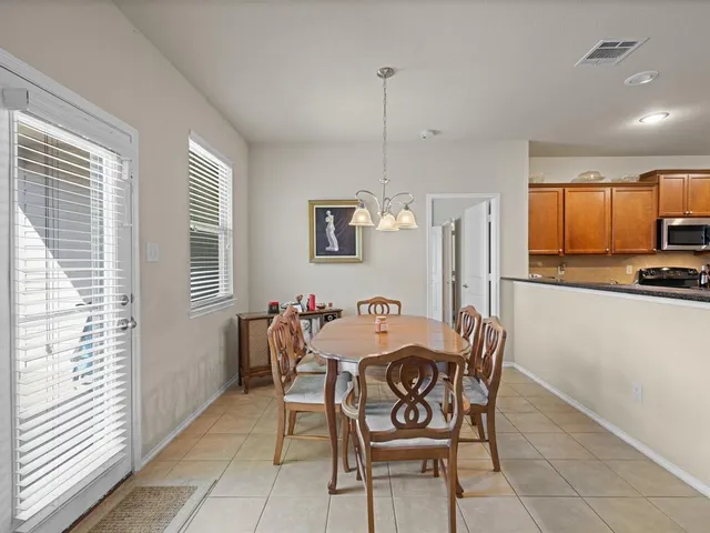 a dining room with furniture and window