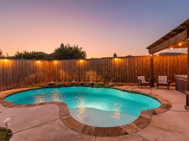 an outdoor view with swimming pool and outdoor seating