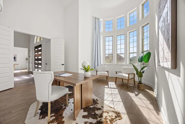 a view of a dining room with furniture window and wooden floor