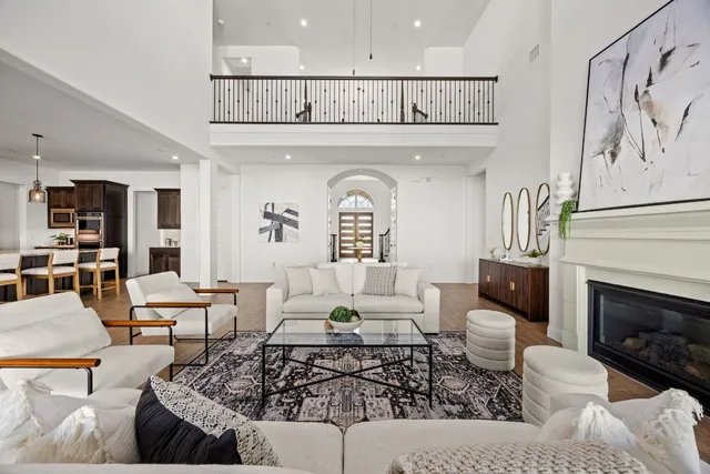 a living room with furniture a rug and a fireplace