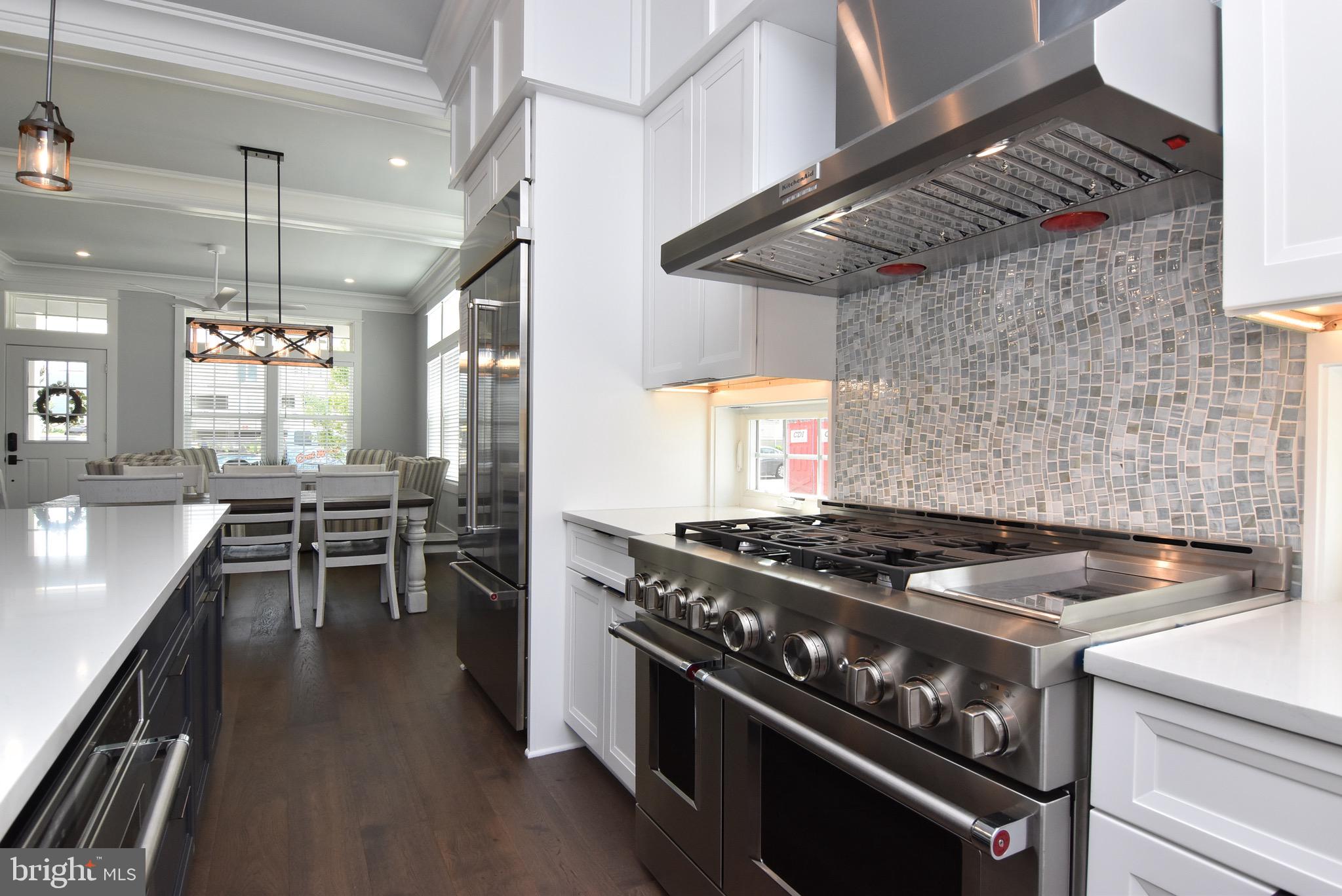3 Laurel Street Rehoboth Beach, DE 19971 - Photo 13 of 47 a stove top oven sitting inside of a kitchen
