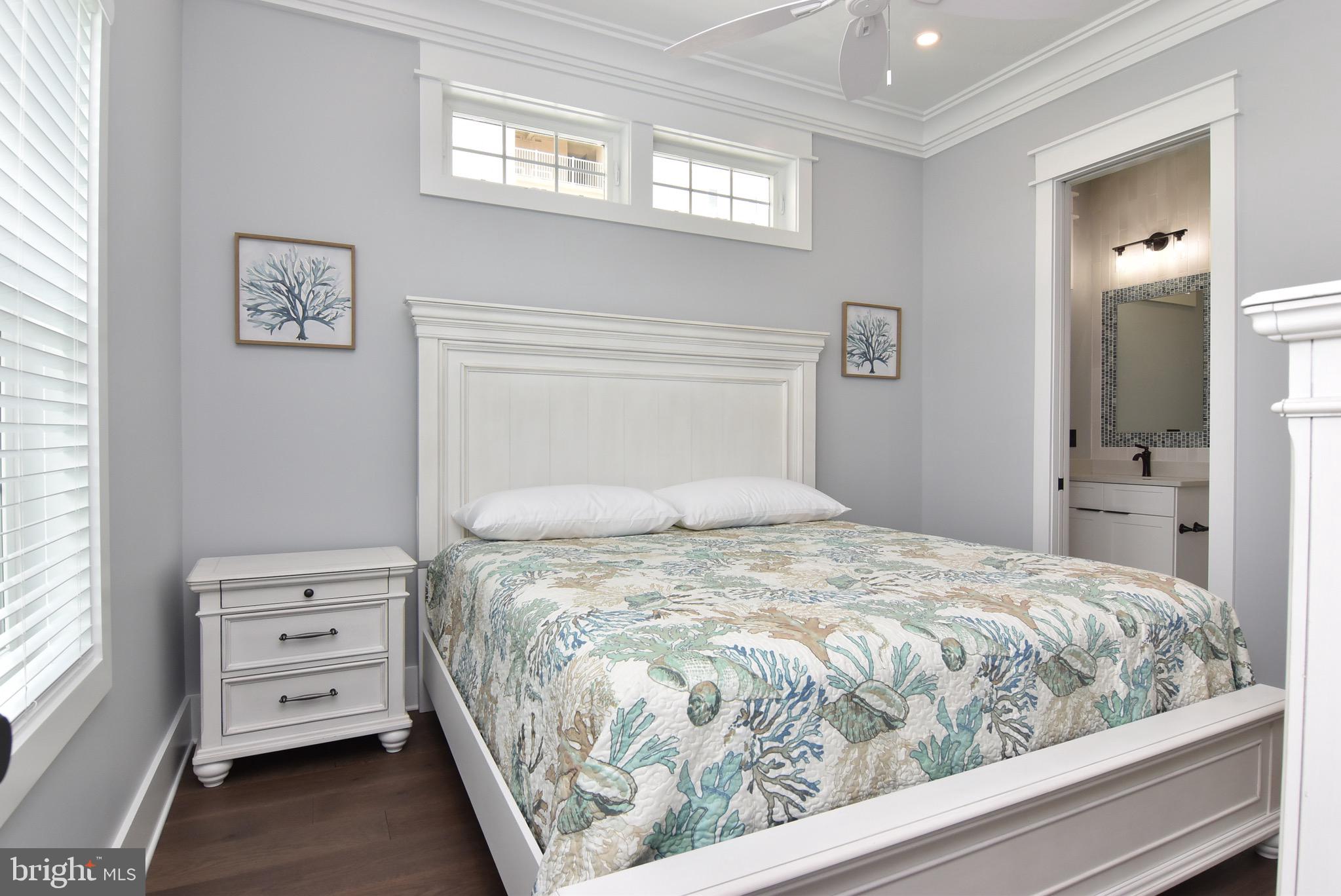 3 Laurel Street Rehoboth Beach, DE 19971 - Photo 15 of 47 a bedroom with a bed and a window