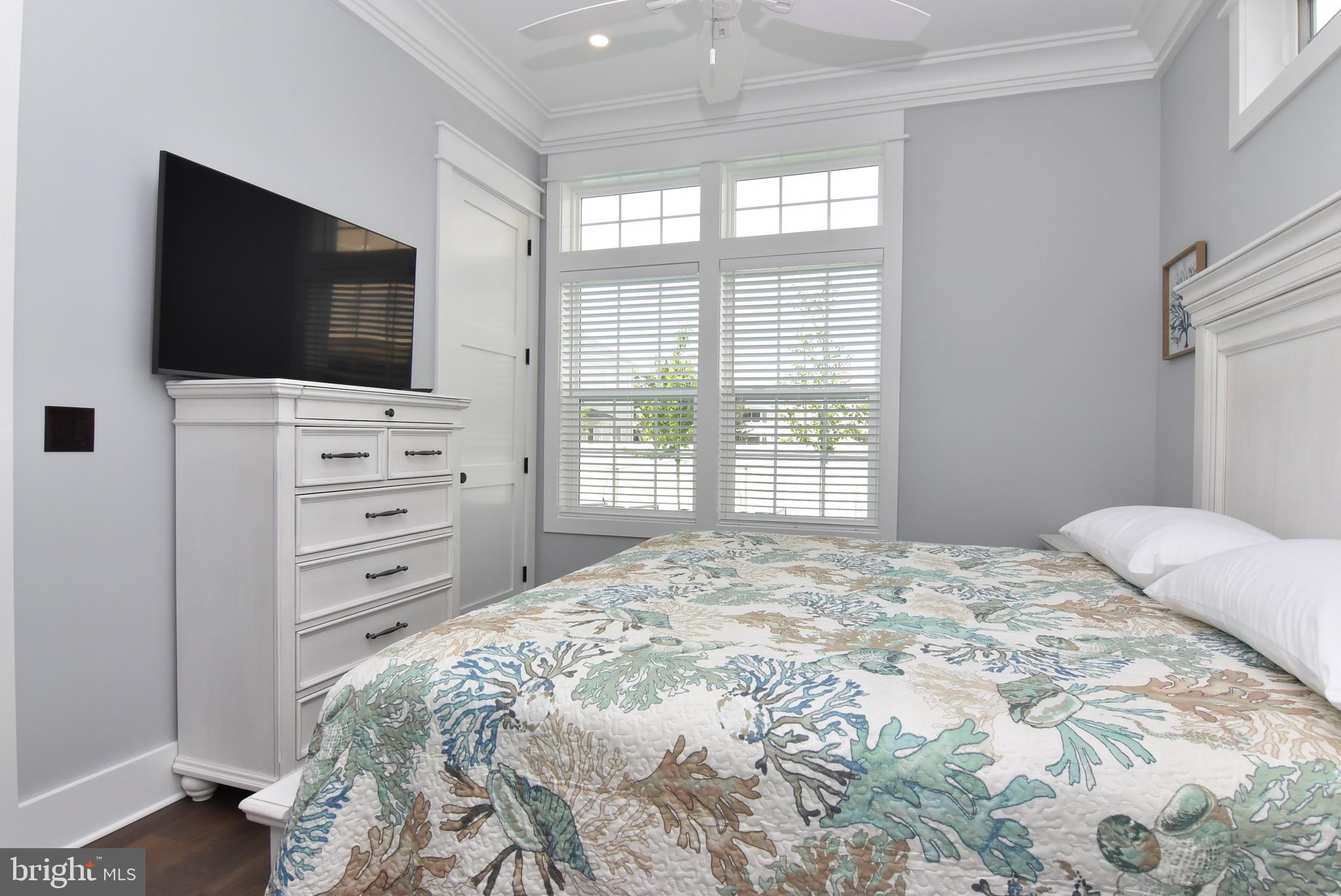 3 Laurel Street Rehoboth Beach, DE 19971 - Photo 17 of 47 a bedroom with a bed and television