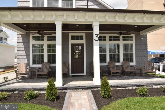 a front view of a building with glass windows and door