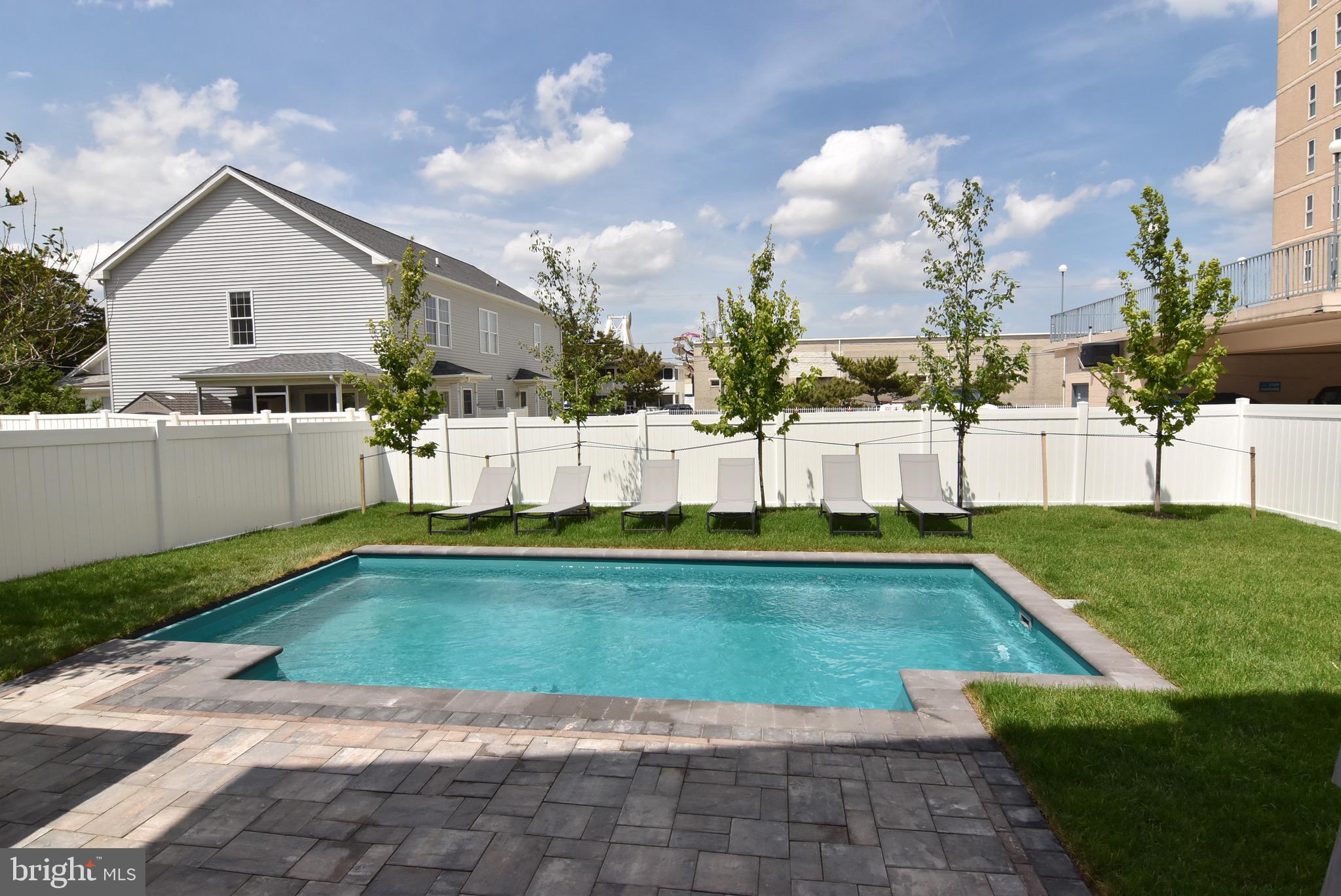 3 Laurel Street Rehoboth Beach, DE 19971 - Photo 3 of 47 a view of a house with swimming pool and a yard