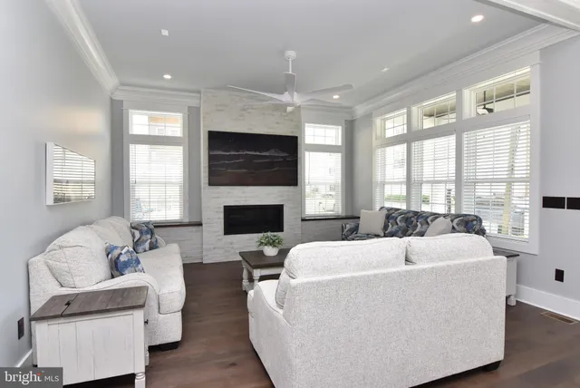 a living room with furniture fireplace and window