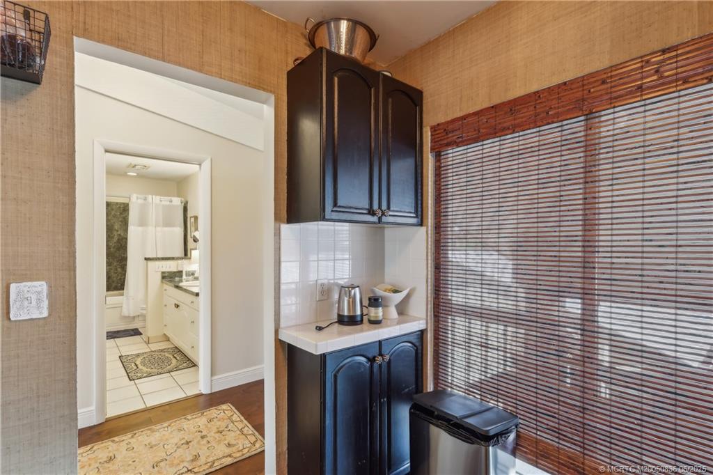 800 Northwest Fork Road, Unit 513 Stuart, FL 34994 - Photo 11 of 30 a bathroom with a sink and a mirror