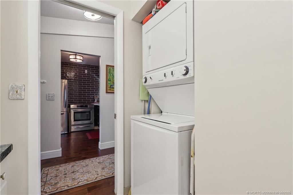 800 Northwest Fork Road, Unit 513 Stuart, FL 34994 - Photo 17 of 30 a view of a hallway with washer and dryer