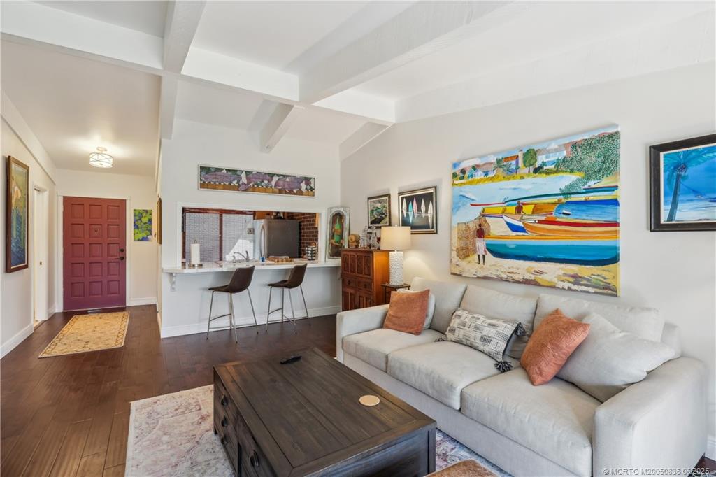 800 Northwest Fork Road, Unit 513 Stuart, FL 34994 - Photo 6 of 30 a living room with furniture and rug