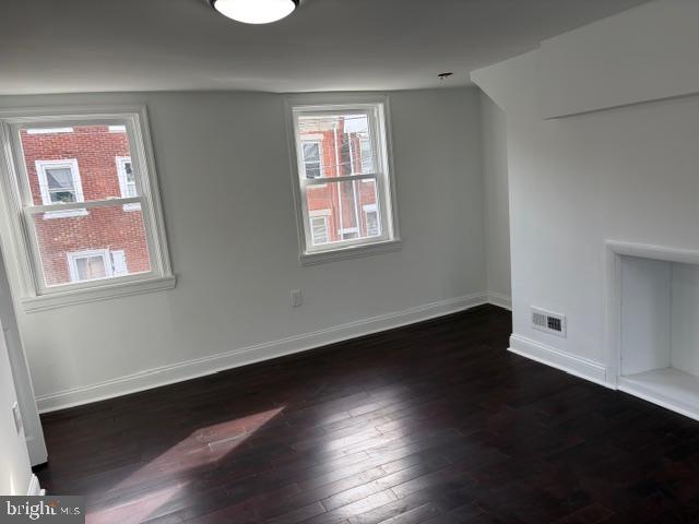 4278 Orchard Street Philadelphia, PA 19124 - Photo 12 of 19 a view of an empty room with wooden floor and a window