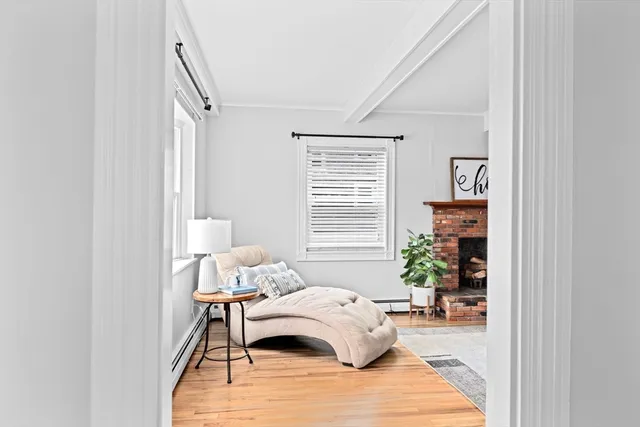 a bedroom with a bed and a potted plant