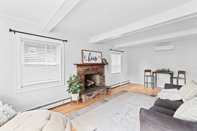 a bedroom with a bed and a fireplace