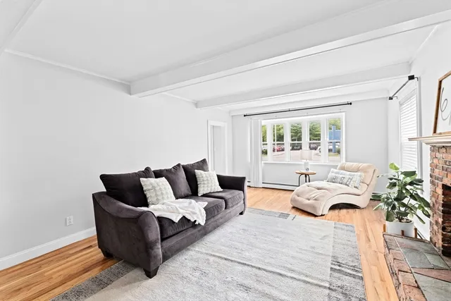 a living room with furniture and fireplace