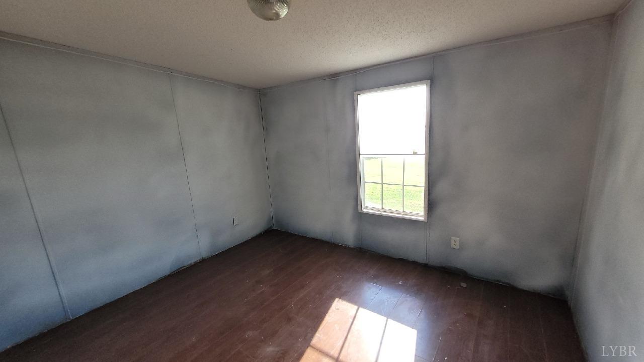 1977 Lyle Thomas Road Spout Spring, VA 24538 - Photo 8 of 11 an empty room with a window