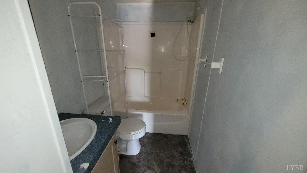 1977 Lyle Thomas Road Spout Spring, VA 24538 - Photo 9 of 11 a bathroom with a sink toilet and shower