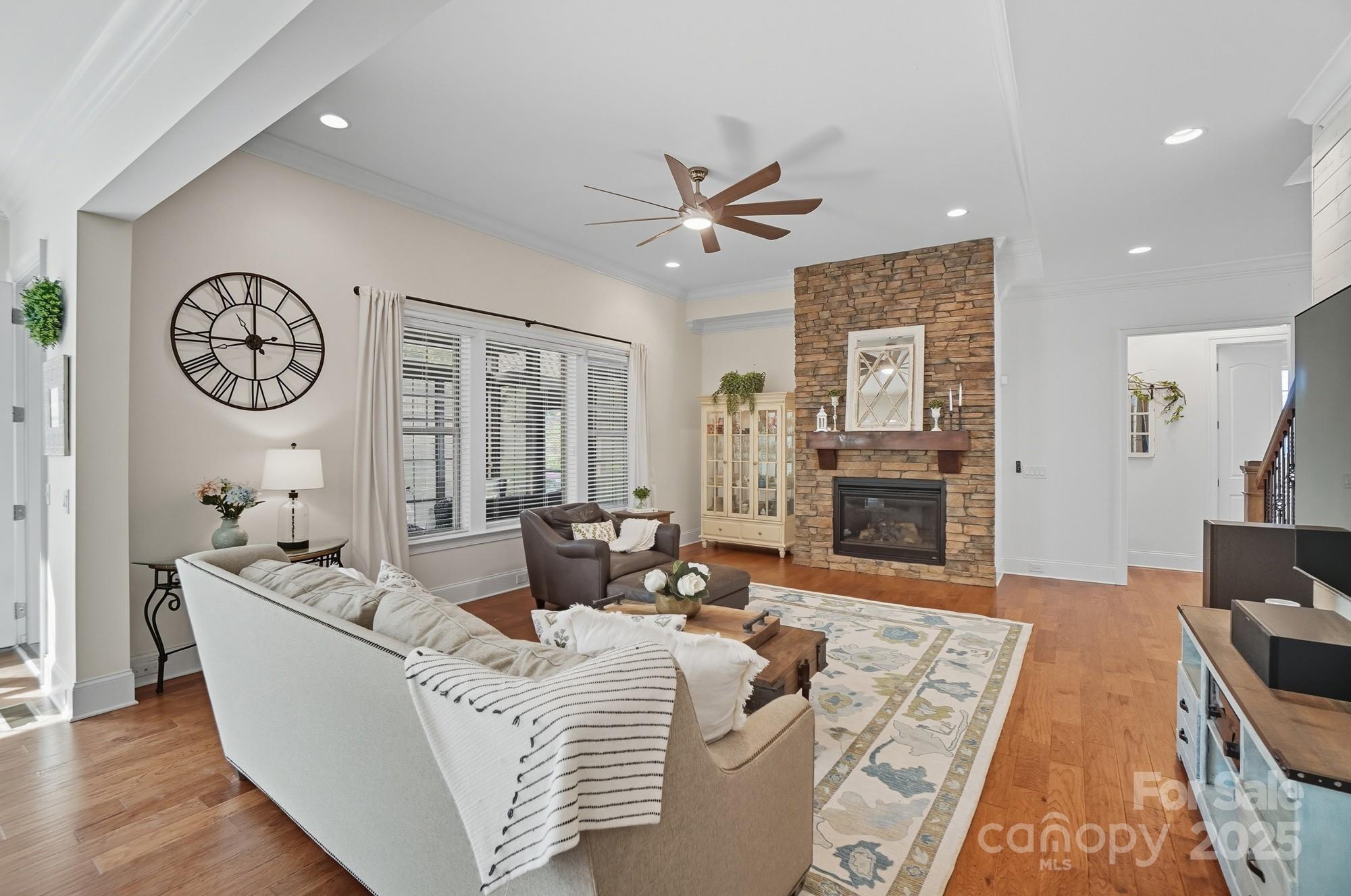 546 Abelia Lane Fort Mill, SC 29708 - Photo 11 of 43 a living room with furniture a fireplace and a table