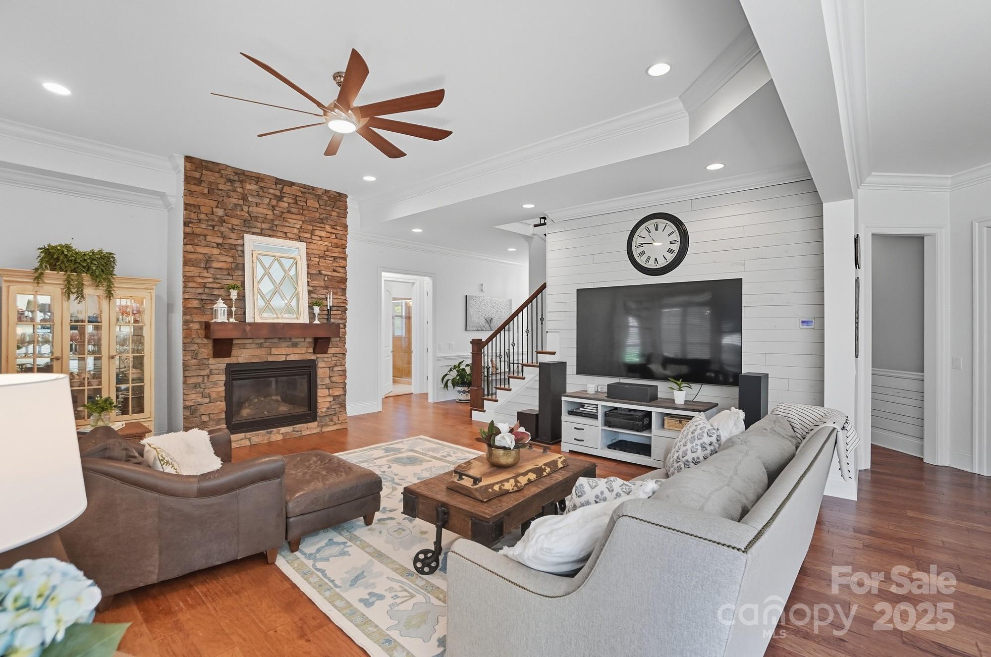 546 Abelia Lane Fort Mill, SC 29708 - Photo 12 of 43 a living room with furniture a fireplace and a flat screen tv