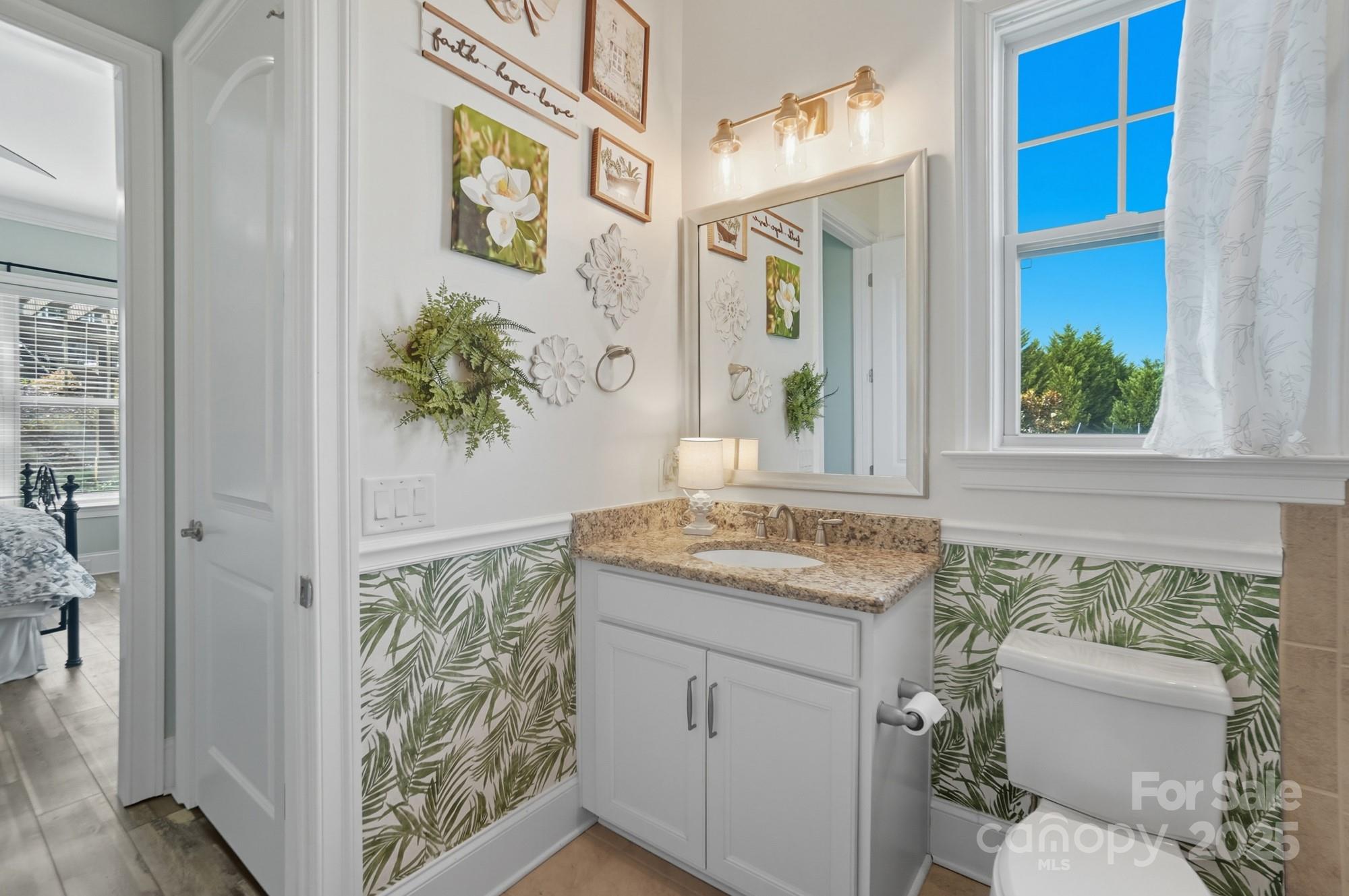 546 Abelia Lane Fort Mill, SC 29708 - Photo 20 of 43 a bathroom with a granite countertop sink and a toilet